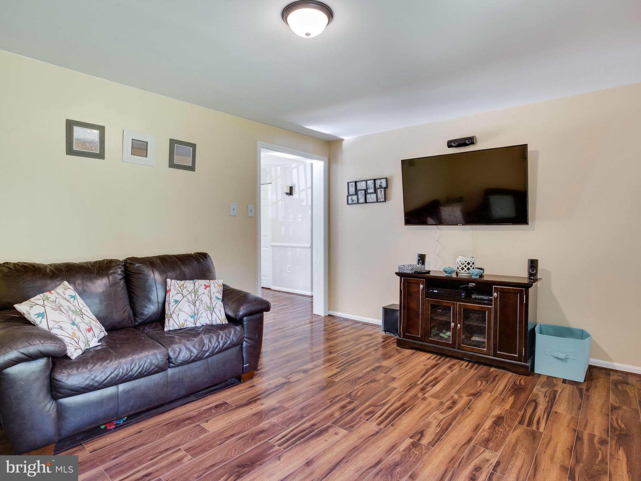 12708 Olivet Road Lusby, MD 20657 - Photo 17 of 22 a living room with furniture and a flat screen tv