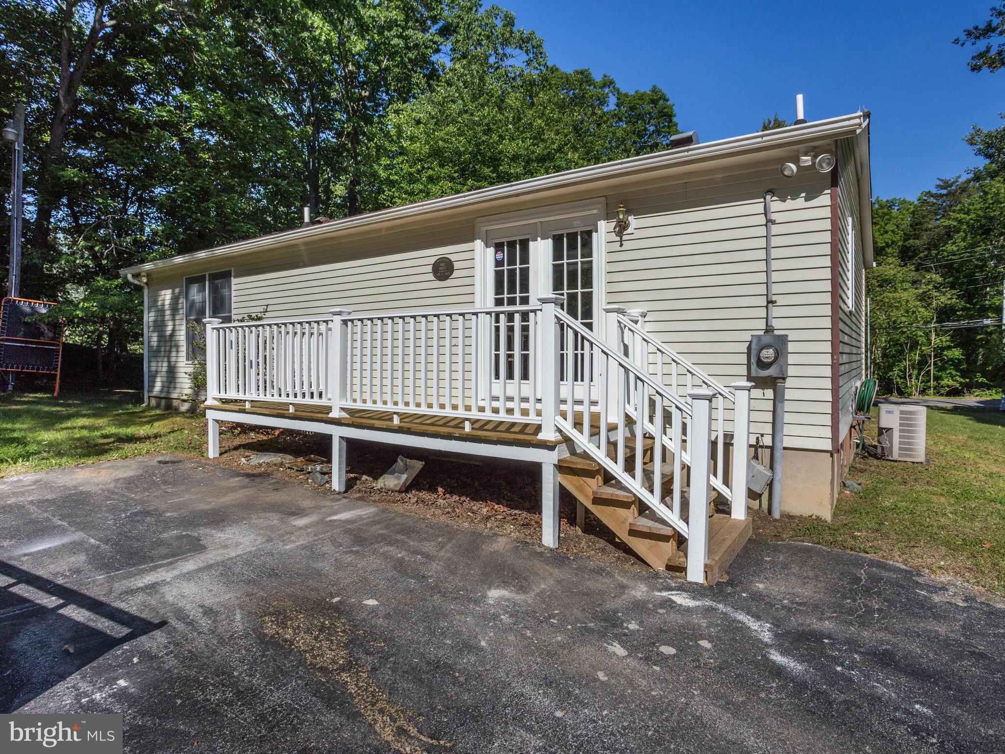 12708 Olivet Road Lusby, MD 20657 - Photo 19 of 22 a view of a house with wooden fence