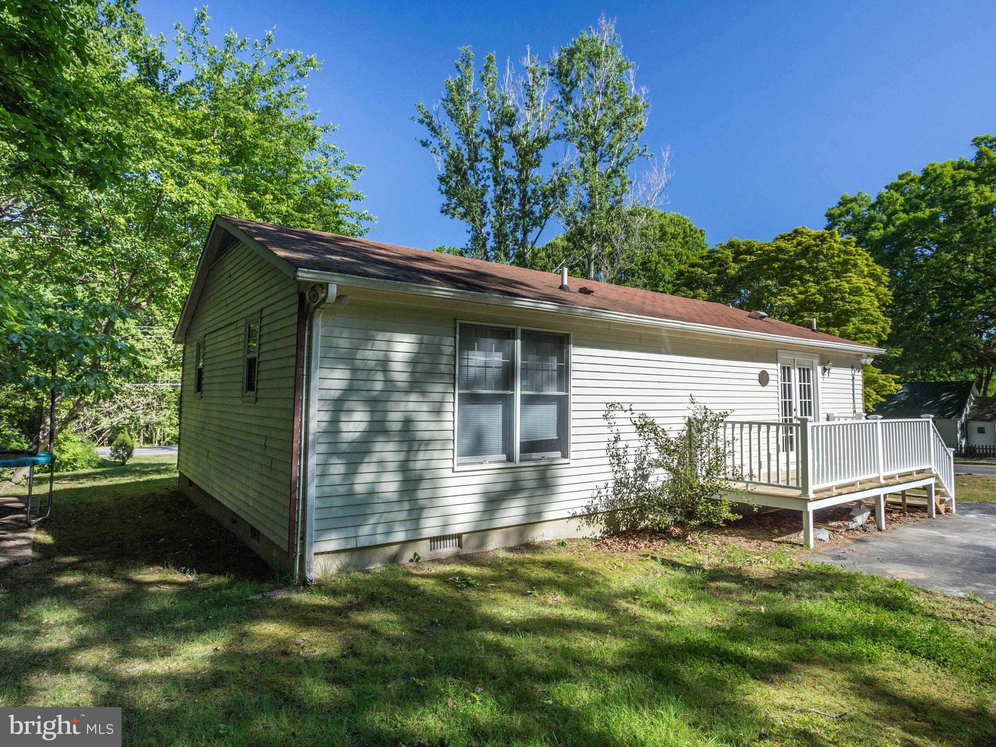 12708 Olivet Road Lusby, MD 20657 - Photo 20 of 22 a view of a house with a yard