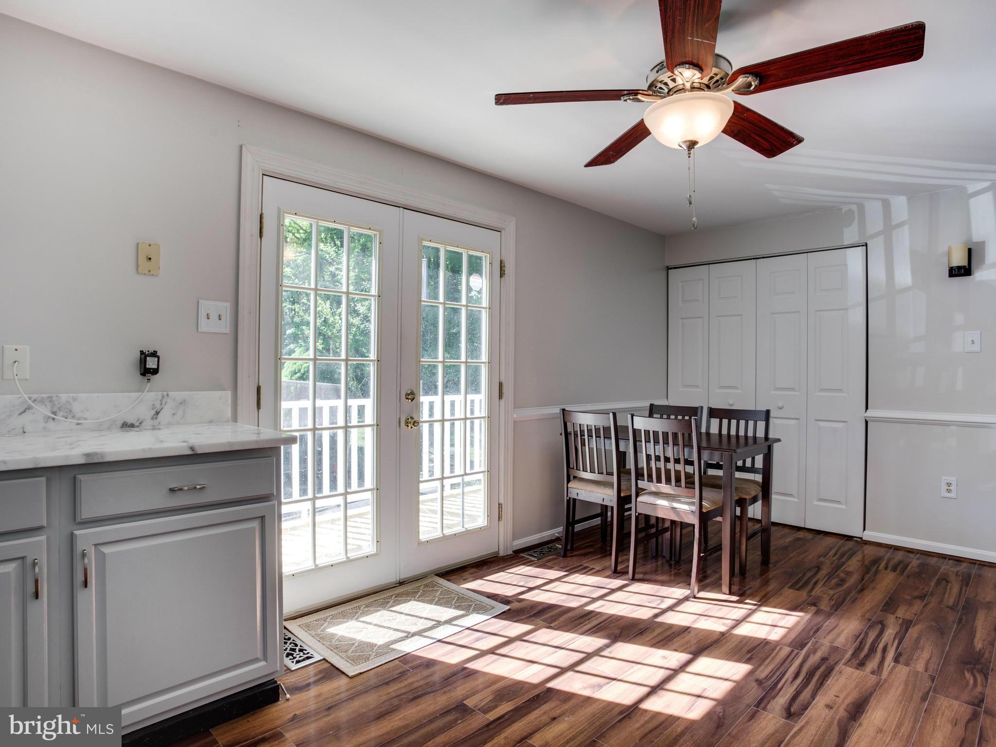 12708 Olivet Road Lusby, MD 20657 - Photo 5 of 22 a view of a dining room with furniture window and wooden floor
