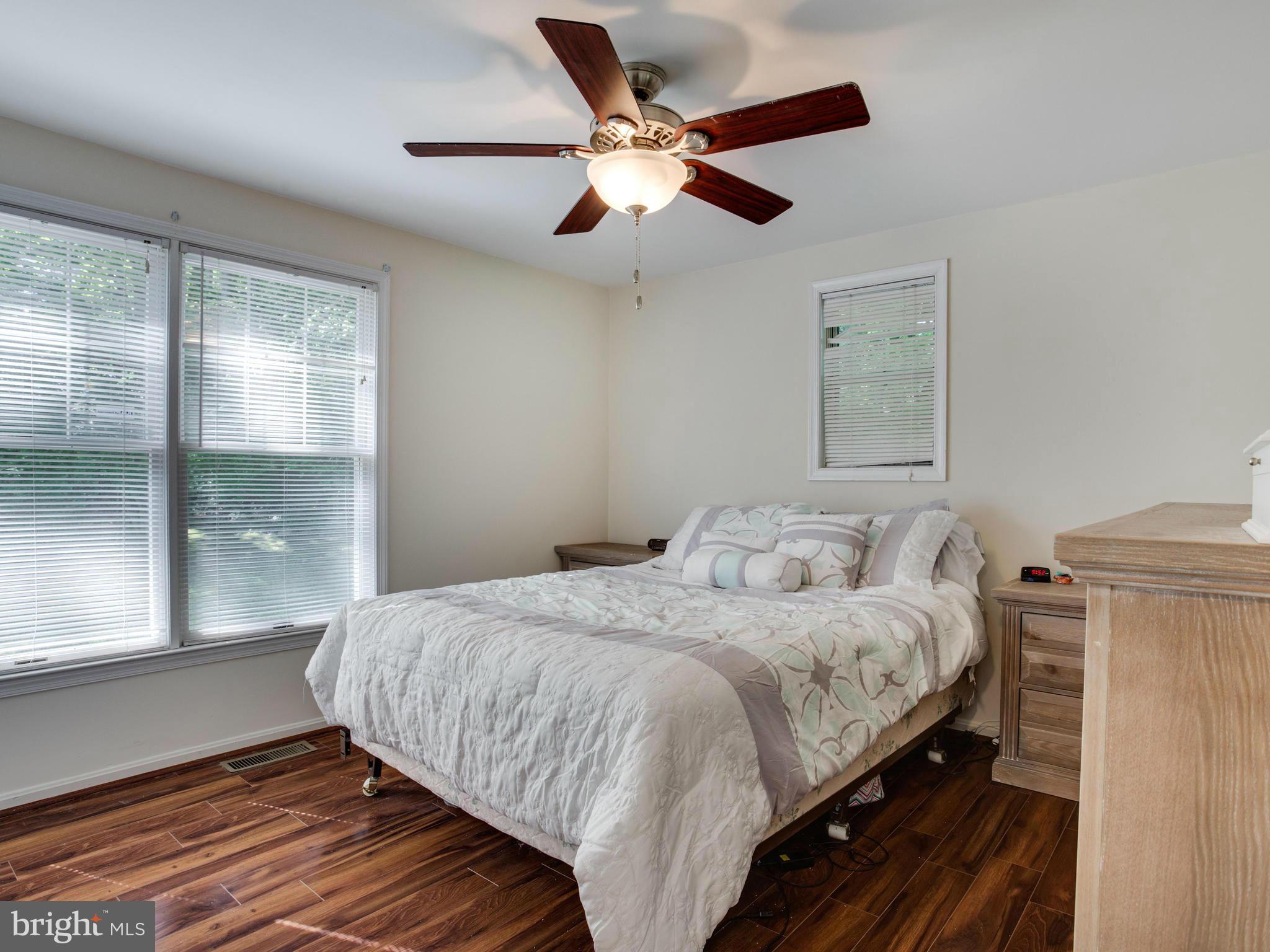 12708 Olivet Road Lusby, MD 20657 - Photo 8 of 22 a bedroom with a bed and a large window