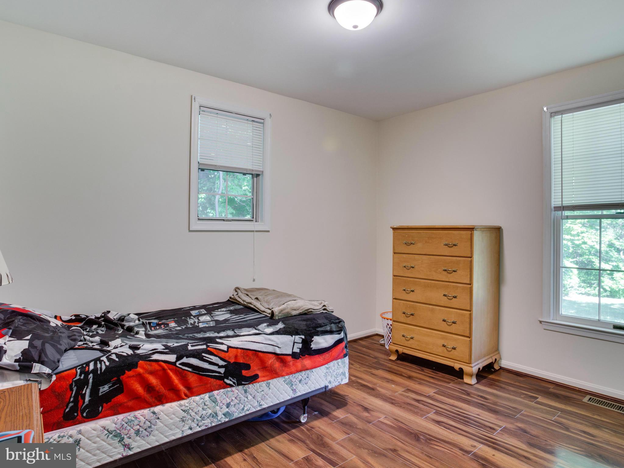 12708 Olivet Road Lusby, MD 20657 - Photo 10 of 22 a bedroom with a bed and a window