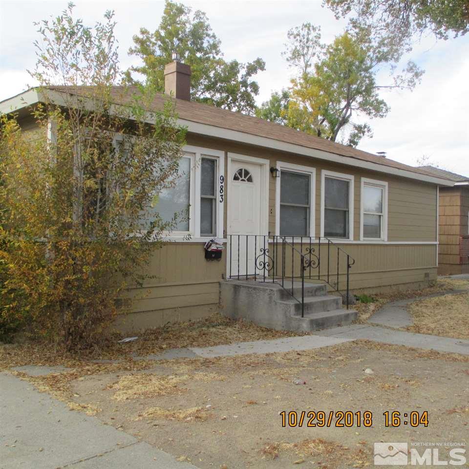 983 Lester Avenue Reno, NV 89502 - Photo 1 of 7 a view of a house with a yard