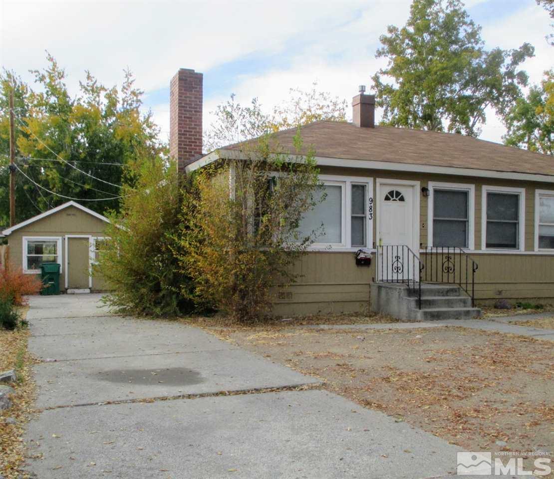 983 Lester Avenue Reno, NV 89502 - Photo 2 of 7 a view of a house with a yard and large tree