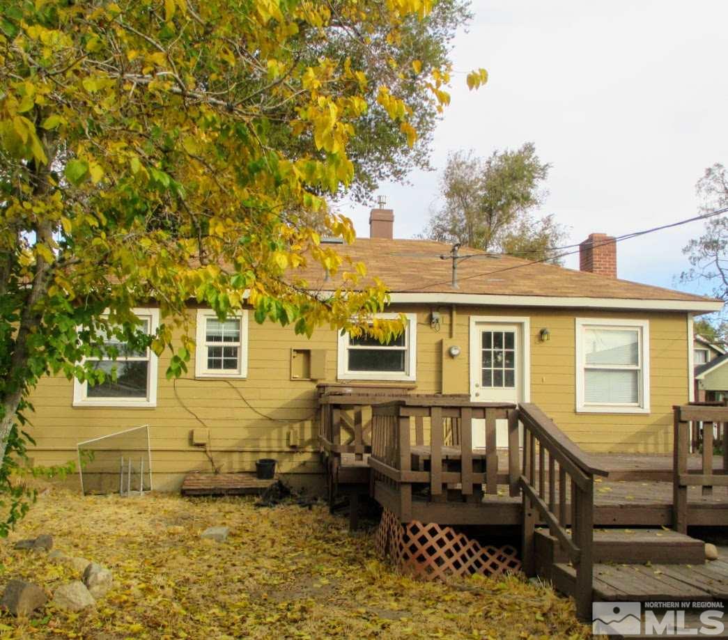 983 Lester Avenue Reno, NV 89502 - Photo 3 of 7 a front view of a house with a wooden fence