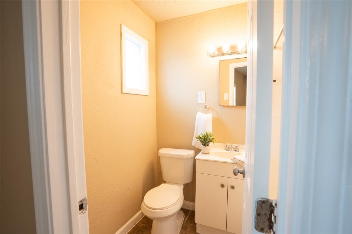 1907 Dismuke Street, Unit 18 Houston, TX 77023 - Photo 8 of 8 a white toilet sitting next to a bathroom sink