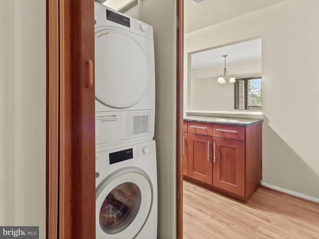 a kitchen with stainless steel appliances granite countertop a refrigerator stove and microwave