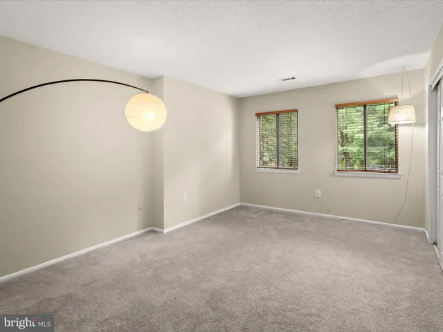 an empty room with a mirror