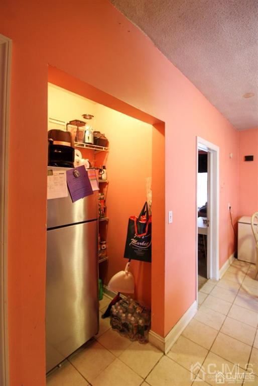 3 Ricord Street Newark, NJ 07106 - Photo 20 of 24 a view of a bedroom with a refrigerator and washer