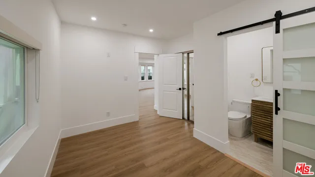 a view of a bathroom with a hardwood and a shower