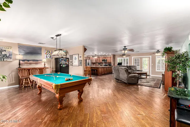 a bedroom with furniture and a flat screen tv