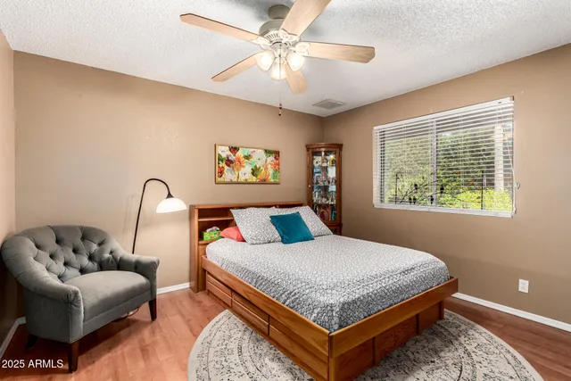 a workspace with wooden floor and furniture