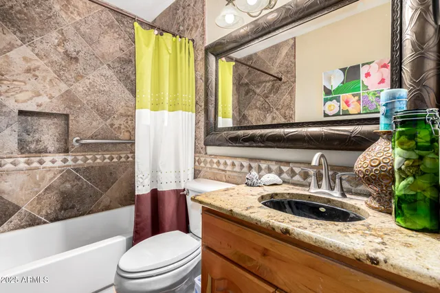 a living room filled with furniture and large windows