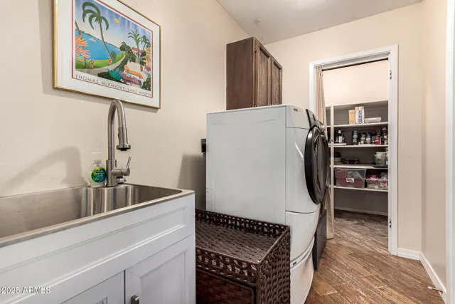 a view of a house with backyard sitting area and garden