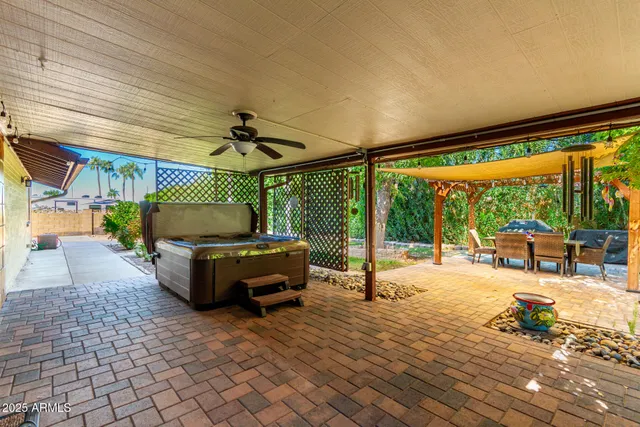 an aerial view of residential houses with outdoor space and swimming pool