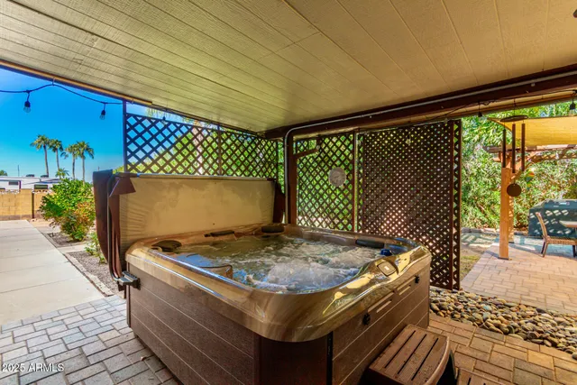 an aerial view of residential houses with outdoor space and ocean view