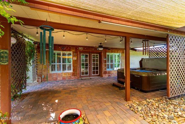 aerial view of a house with a yard and large tree