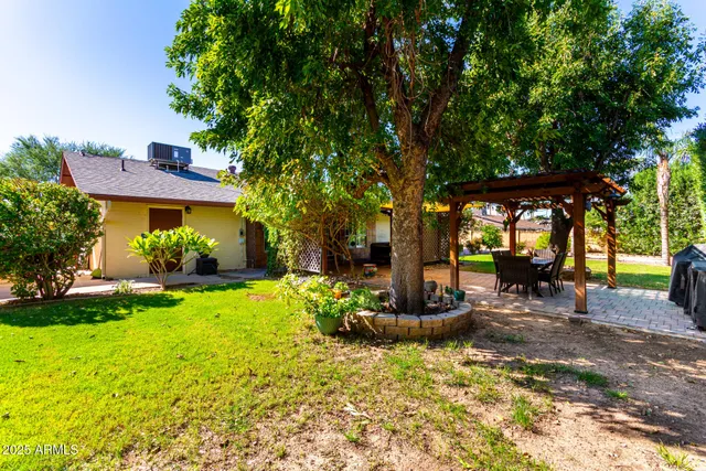 an aerial view of a house with a lake view