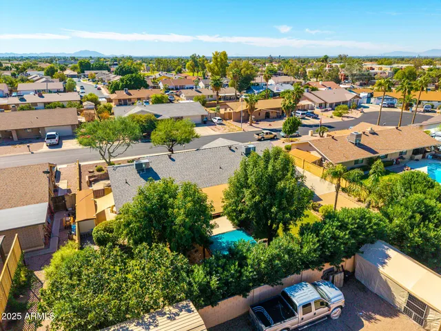 a view of a backyard with table and chairs