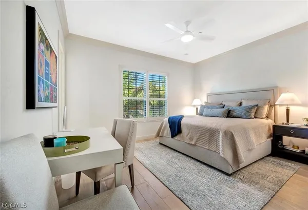 a bedroom with bed and a window