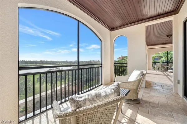 a view of balcony with furniture