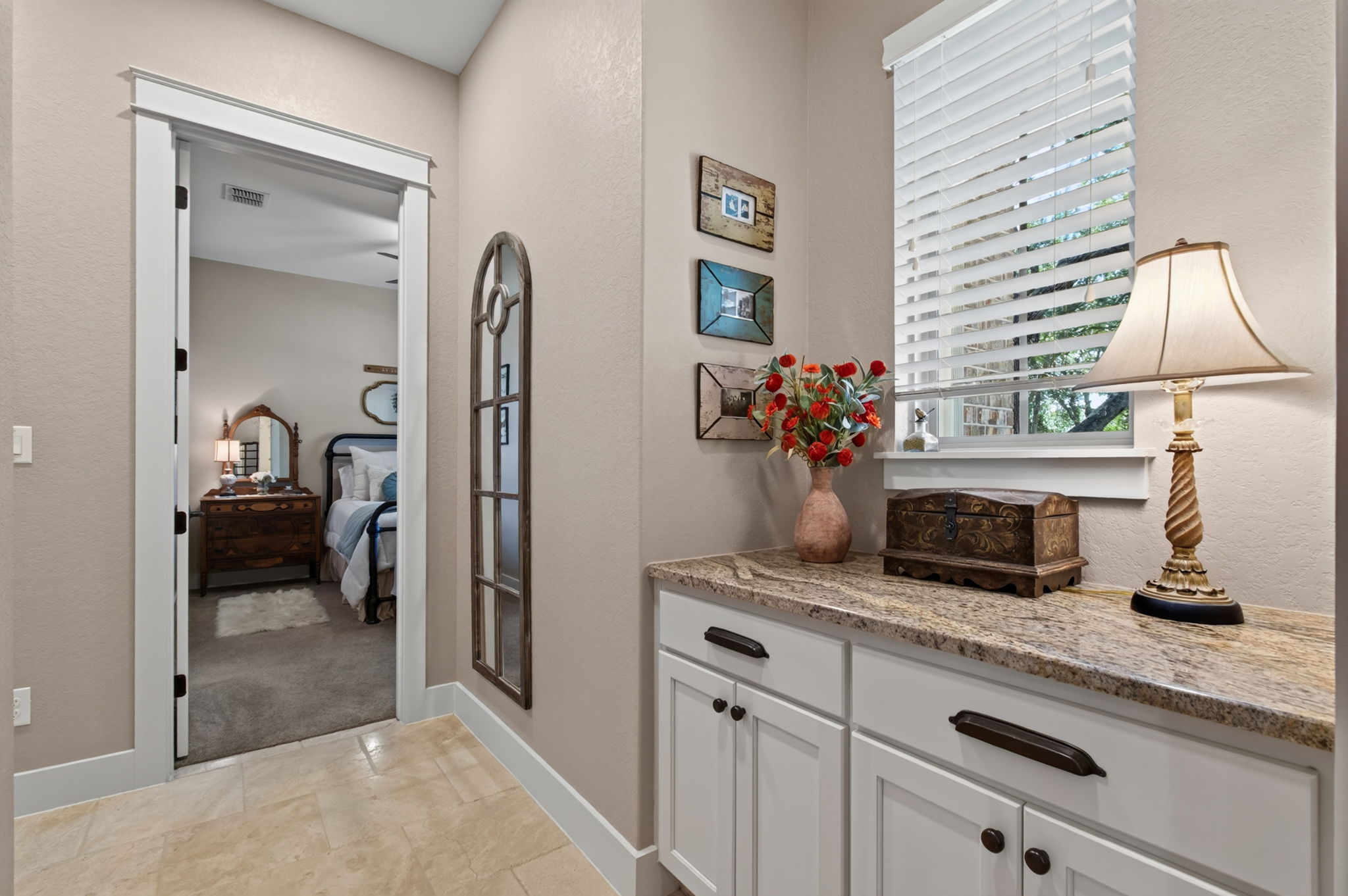715 Long Ridge Spring Branch, TX 78070 - Photo 14 of 40 Granite counters and neutral tile flooring complement this elegant built-in hallway station.