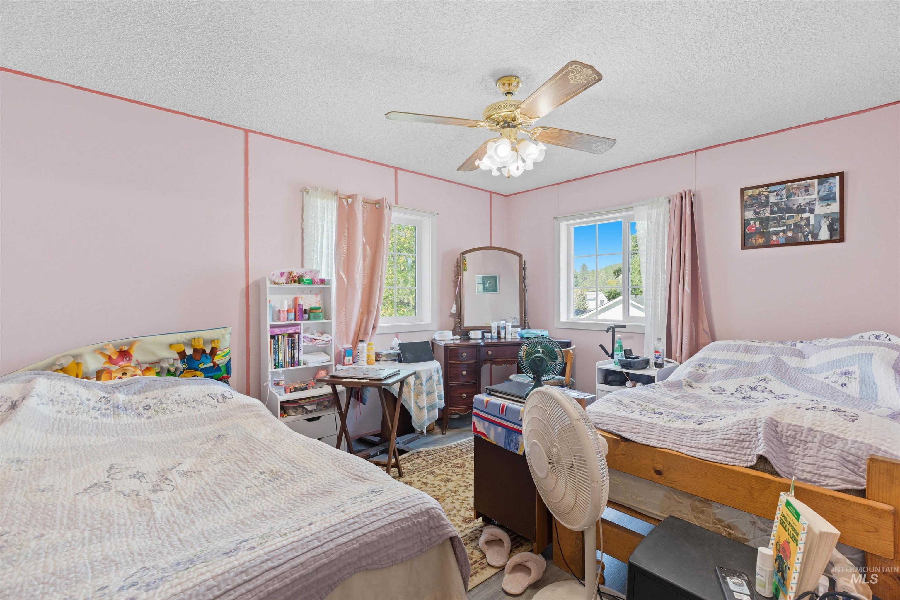 300 Main Street Deary, ID 83823 - Photo 11 of 18 Bedroom featuring a textured ceiling and a ceiling fan