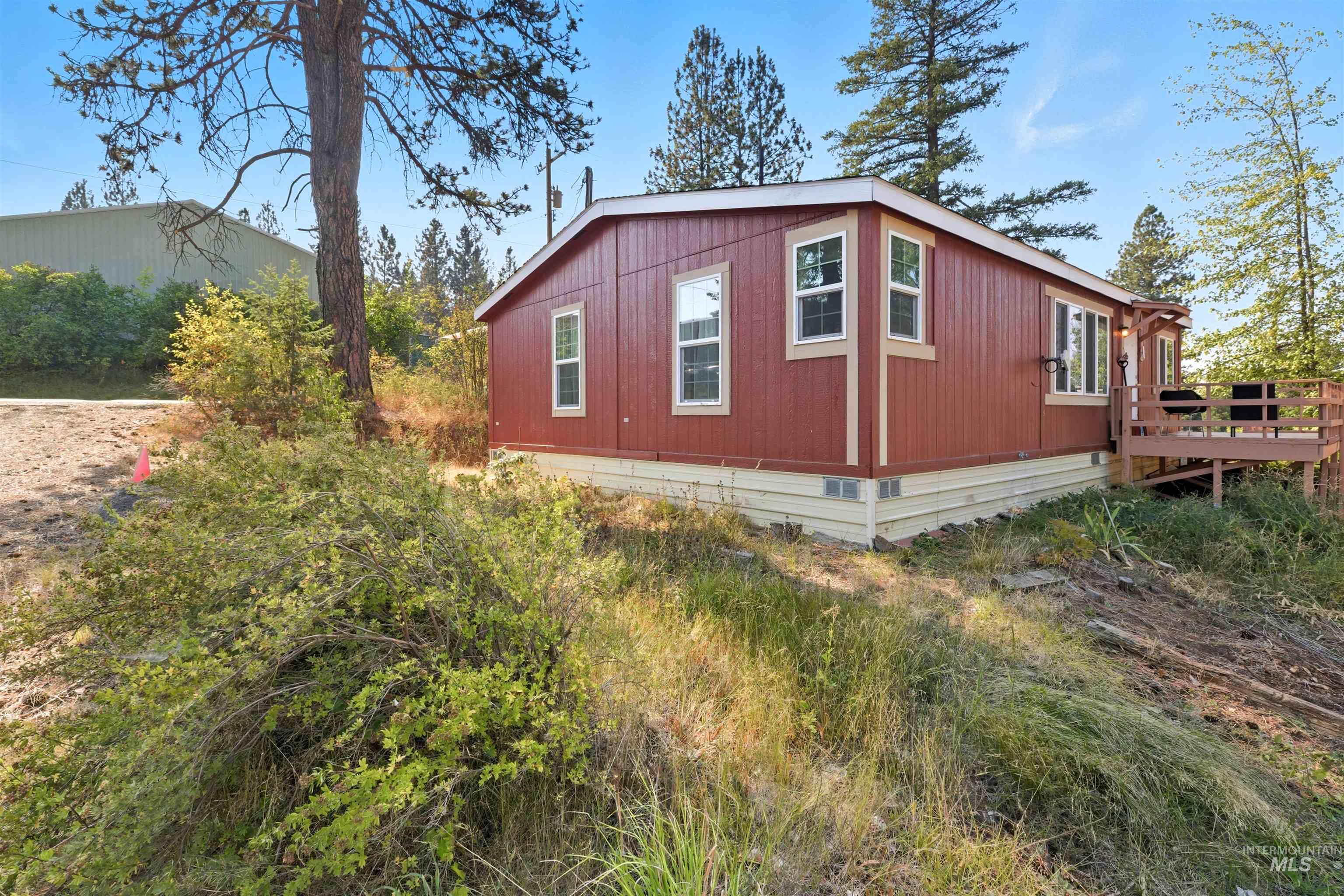 300 Main Street Deary, ID 83823 - Photo 16 of 18 View of side of property with a deck