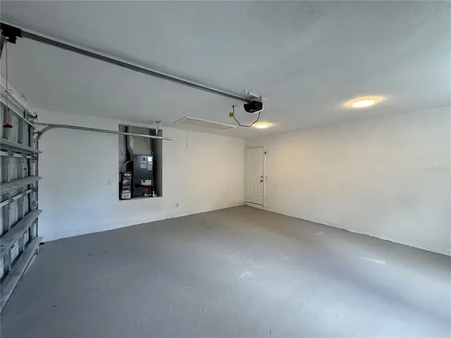 a view of a room with window and ceiling fan