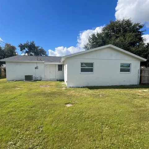 a view of a backyard of the house