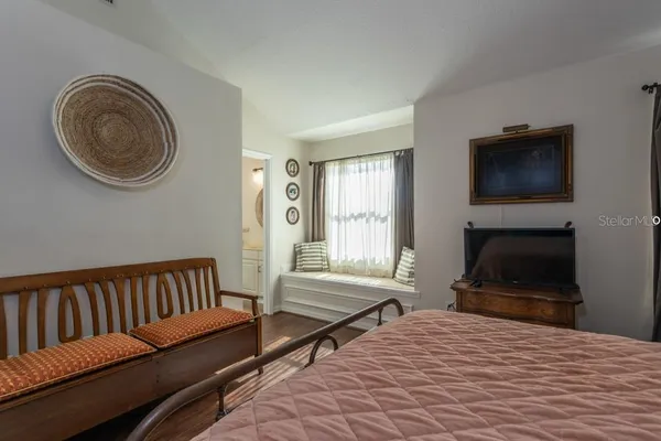 a bathroom with a toilet sink and shower