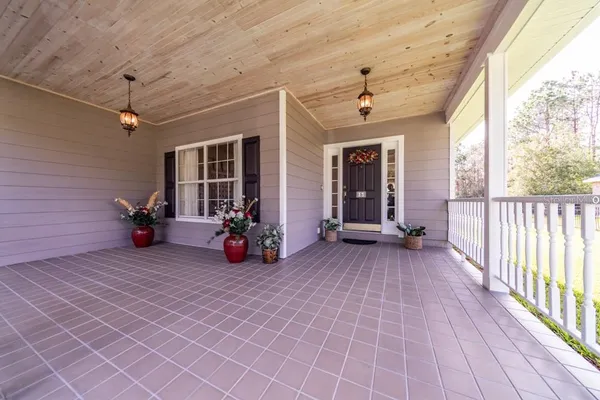 a view of a porch and garden