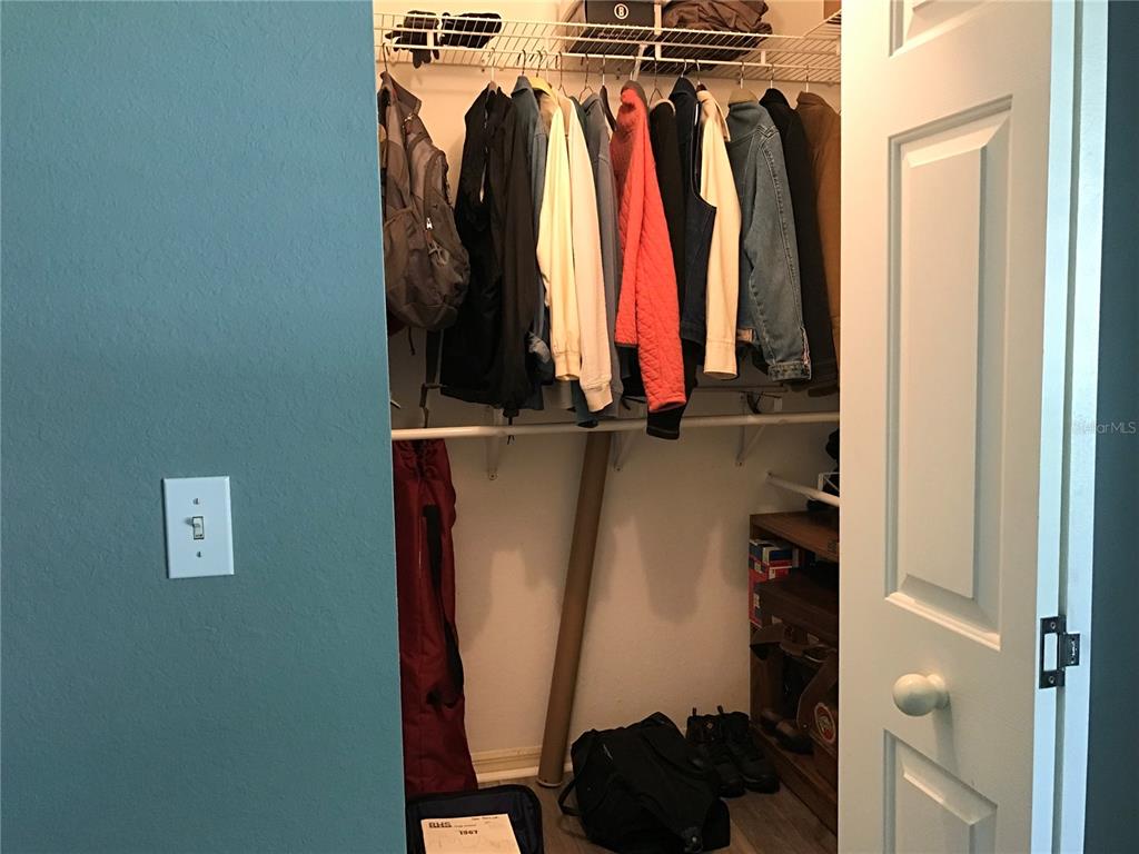 11879 Southwest 137th Loop Dunnellon, FL 34432 - Photo 16 of 37 a view of walk in closet with clothes and shoes