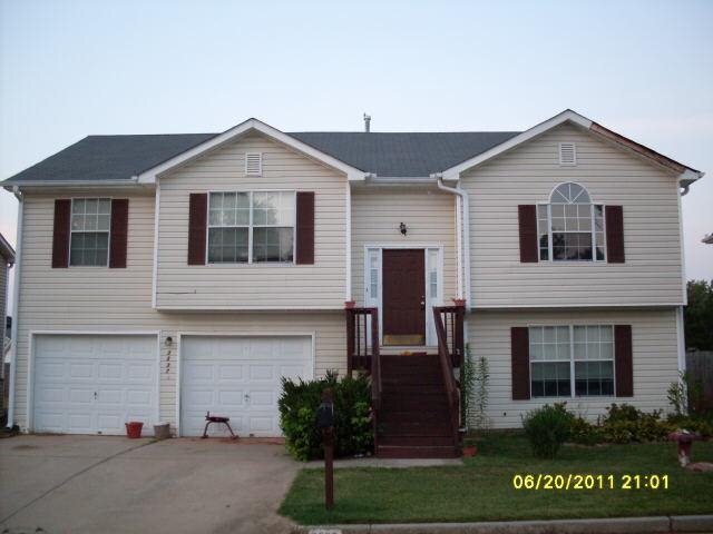 3337 Springside Ridge Decatur, GA 30034 - Photo 1 of 1 a front view of a house with a yard and garage