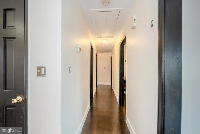 a workspace with wooden floor and a window