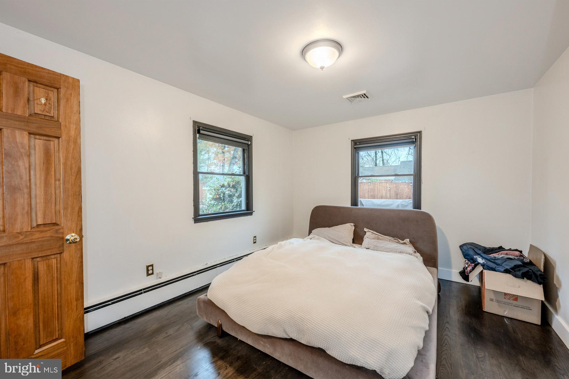 1329 Devils Reach Road Woodbridge, VA 22192 - Photo 13 of 34 a bedroom with a bed and wooden floor