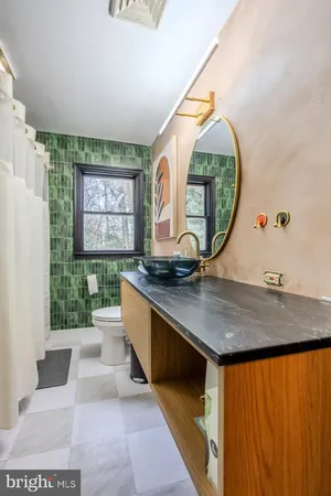 a room with pool table and windows