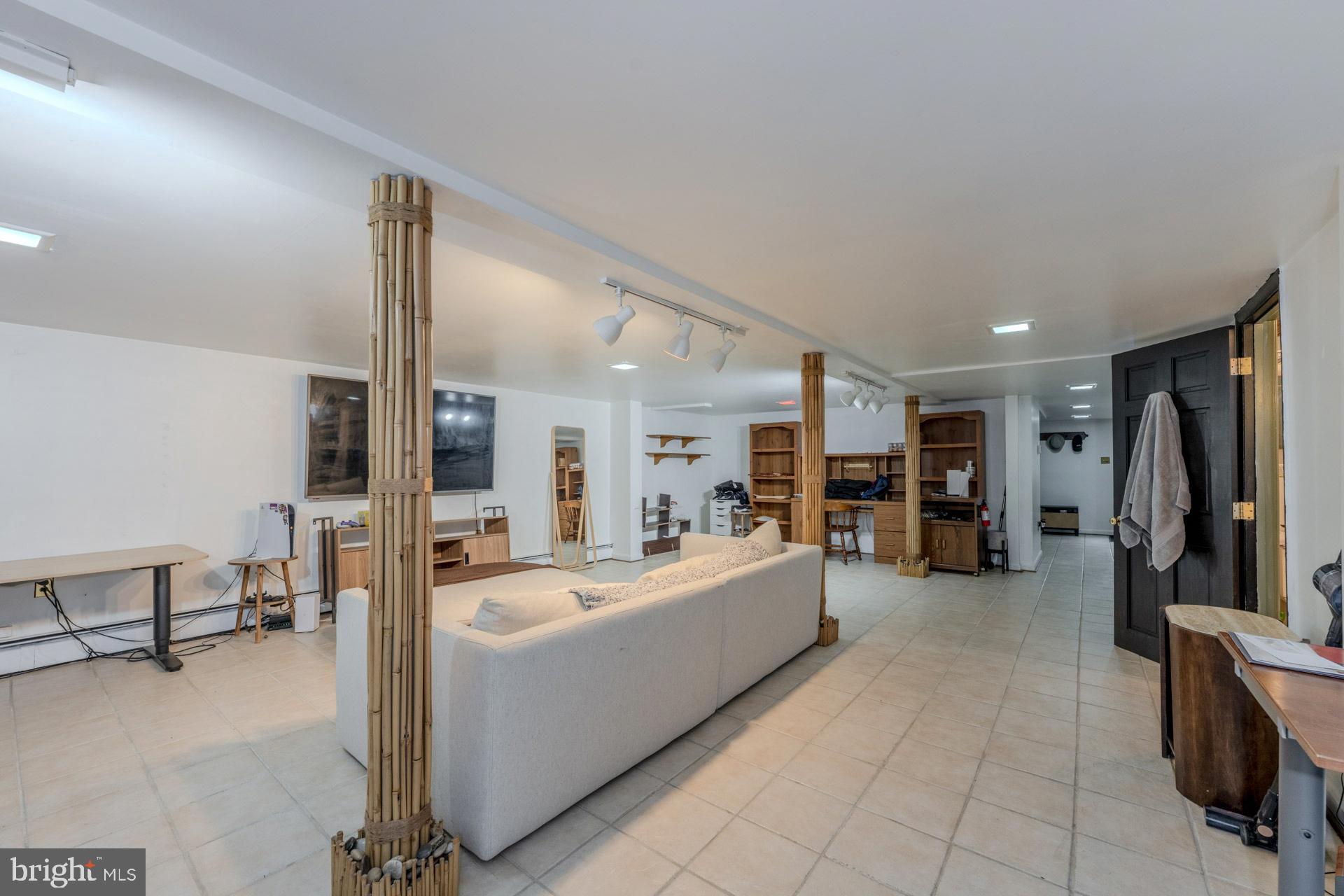1329 Devils Reach Road Woodbridge, VA 22192 - Photo 21 of 33 a living room with furniture and a flat screen tv
