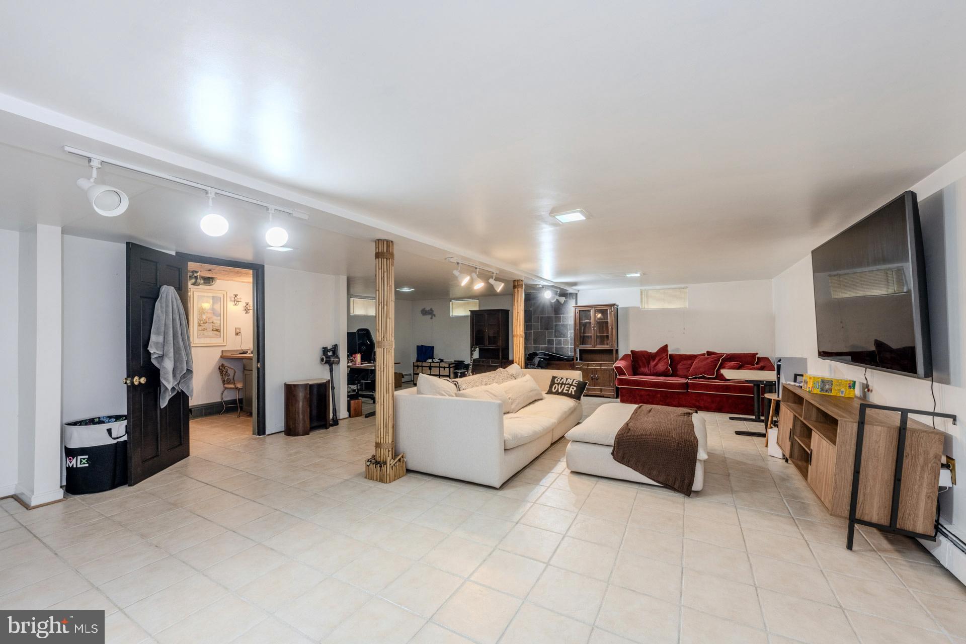 1329 Devils Reach Road Woodbridge, VA 22192 - Photo 21 of 34 a living room with furniture and a flat screen tv