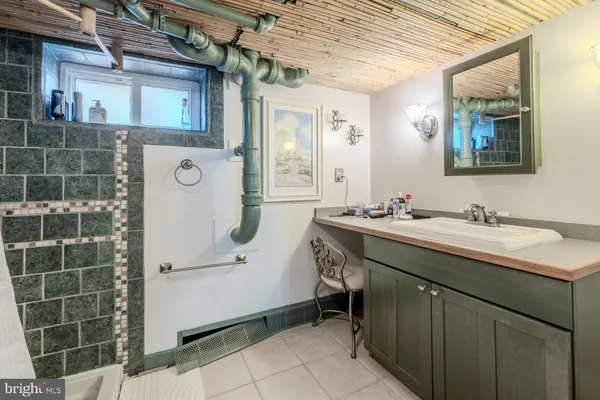 a bathroom with a sink and mirror