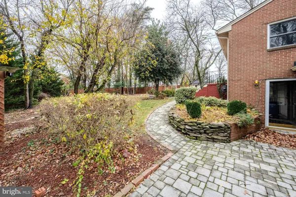 a backyard of a house with yard and outdoor seating