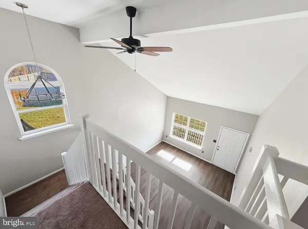a view of a hallway with windows