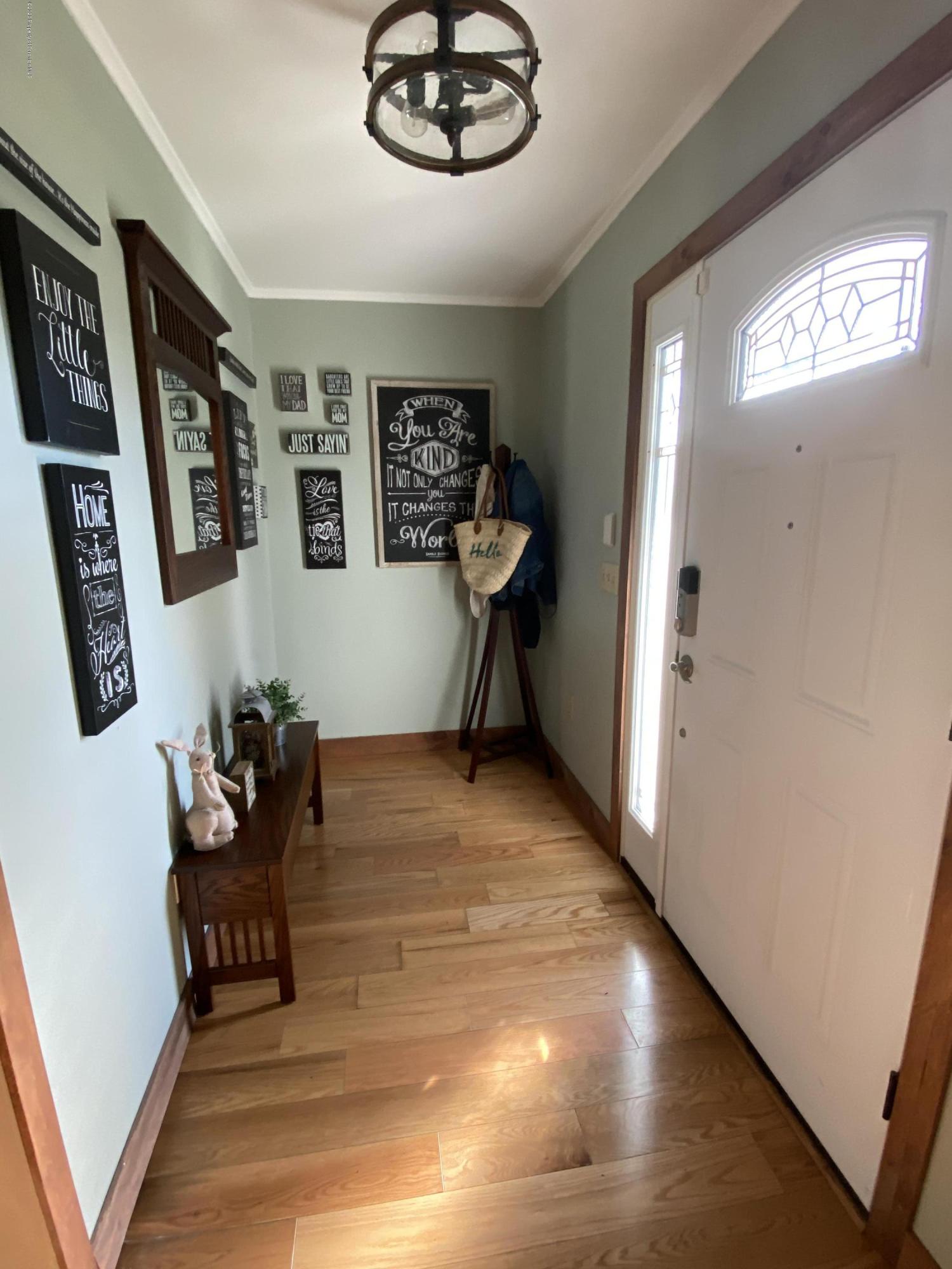 225 Terrace Street Shavertown, PA 18708 - Photo 16 of 19 a living room with furniture and a chandelier