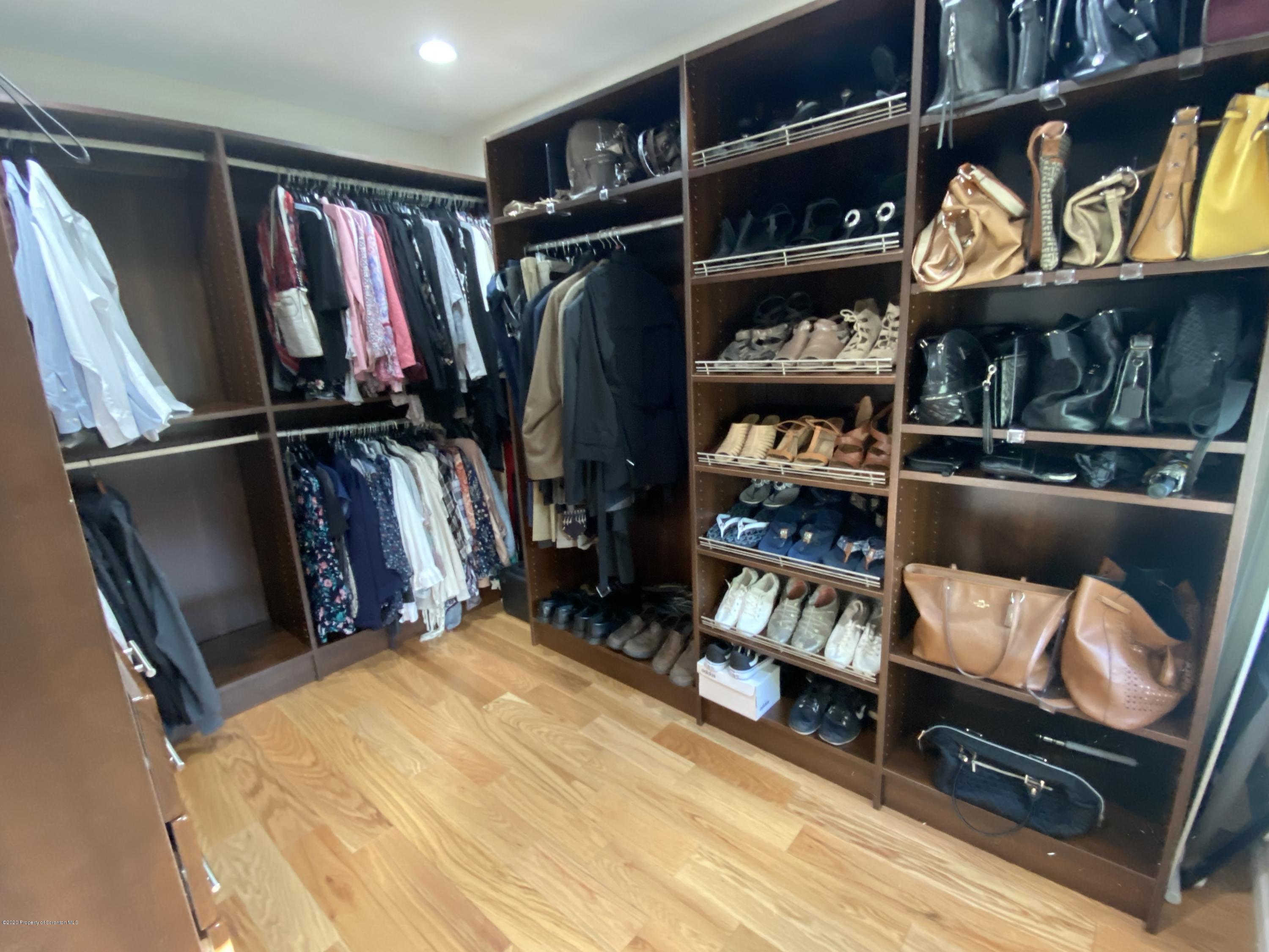 225 Terrace Street Shavertown, PA 18708 - Photo 19 of 19 a view of walk in closet with clothes and shoes