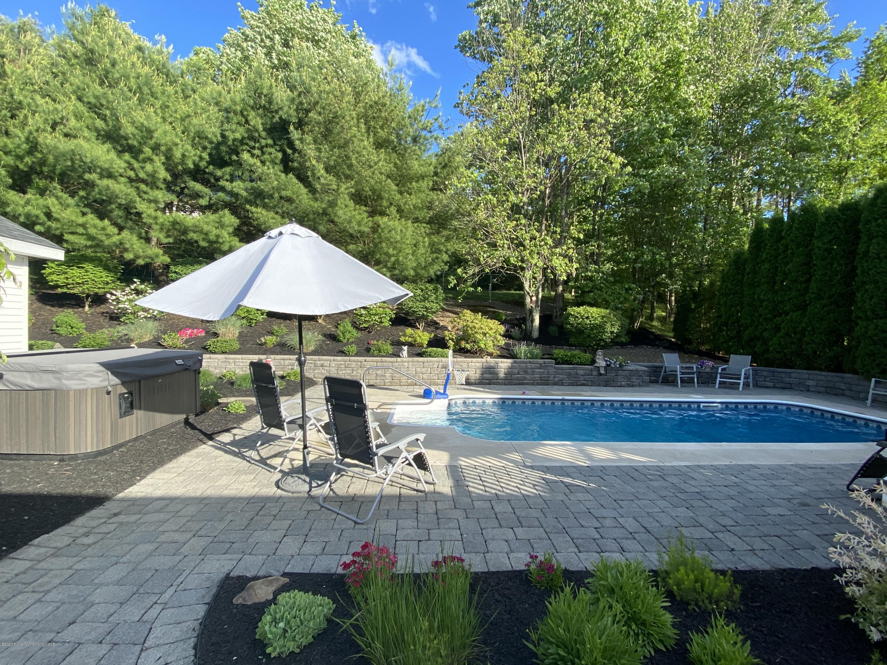 225 Terrace Street Shavertown, PA 18708 - Photo 4 of 19 a view of backyard with outdoor seating and trees