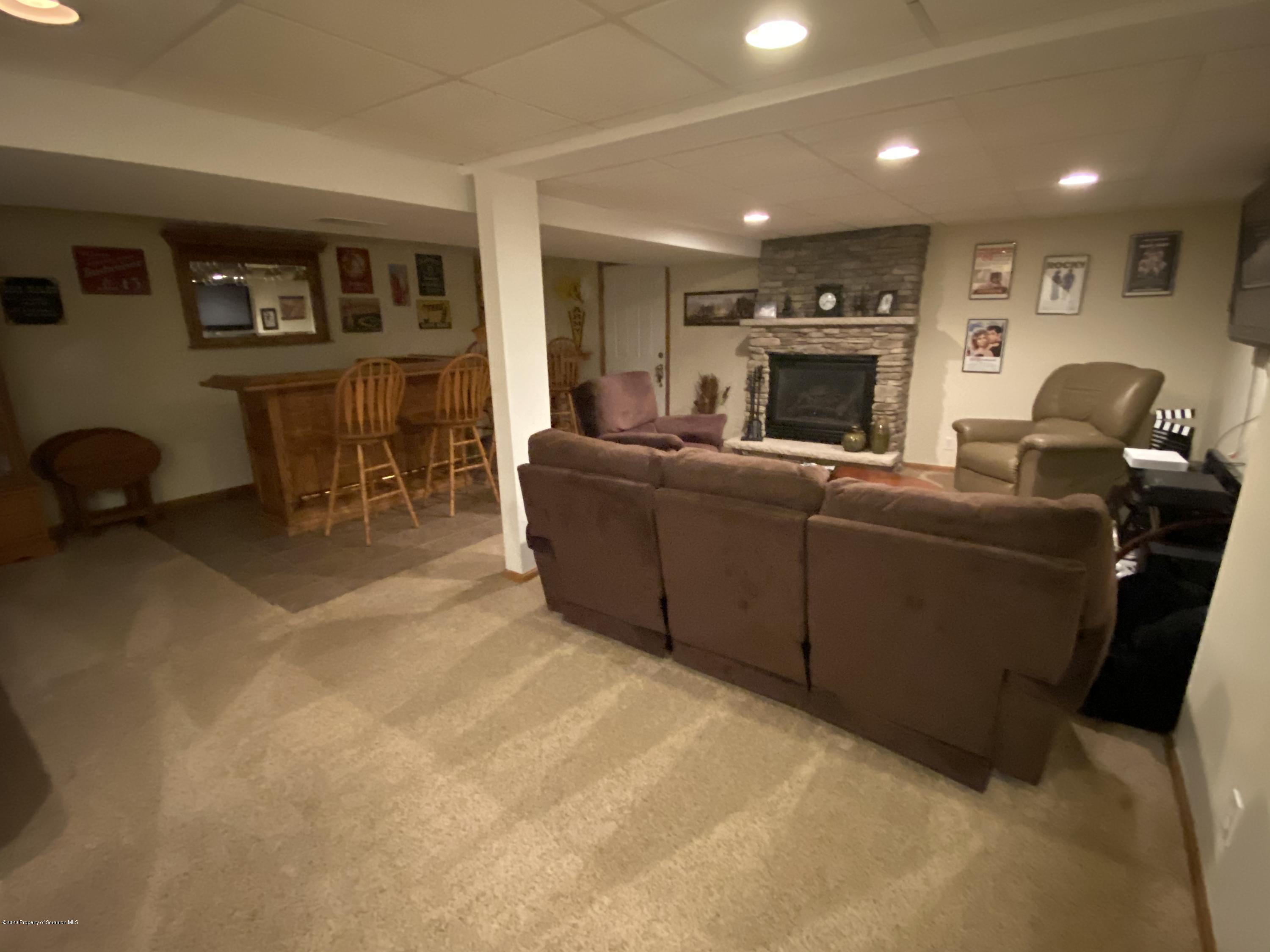 225 Terrace Street Shavertown, PA 18708 - Photo 9 of 19 a living room with furniture a window and a fireplace