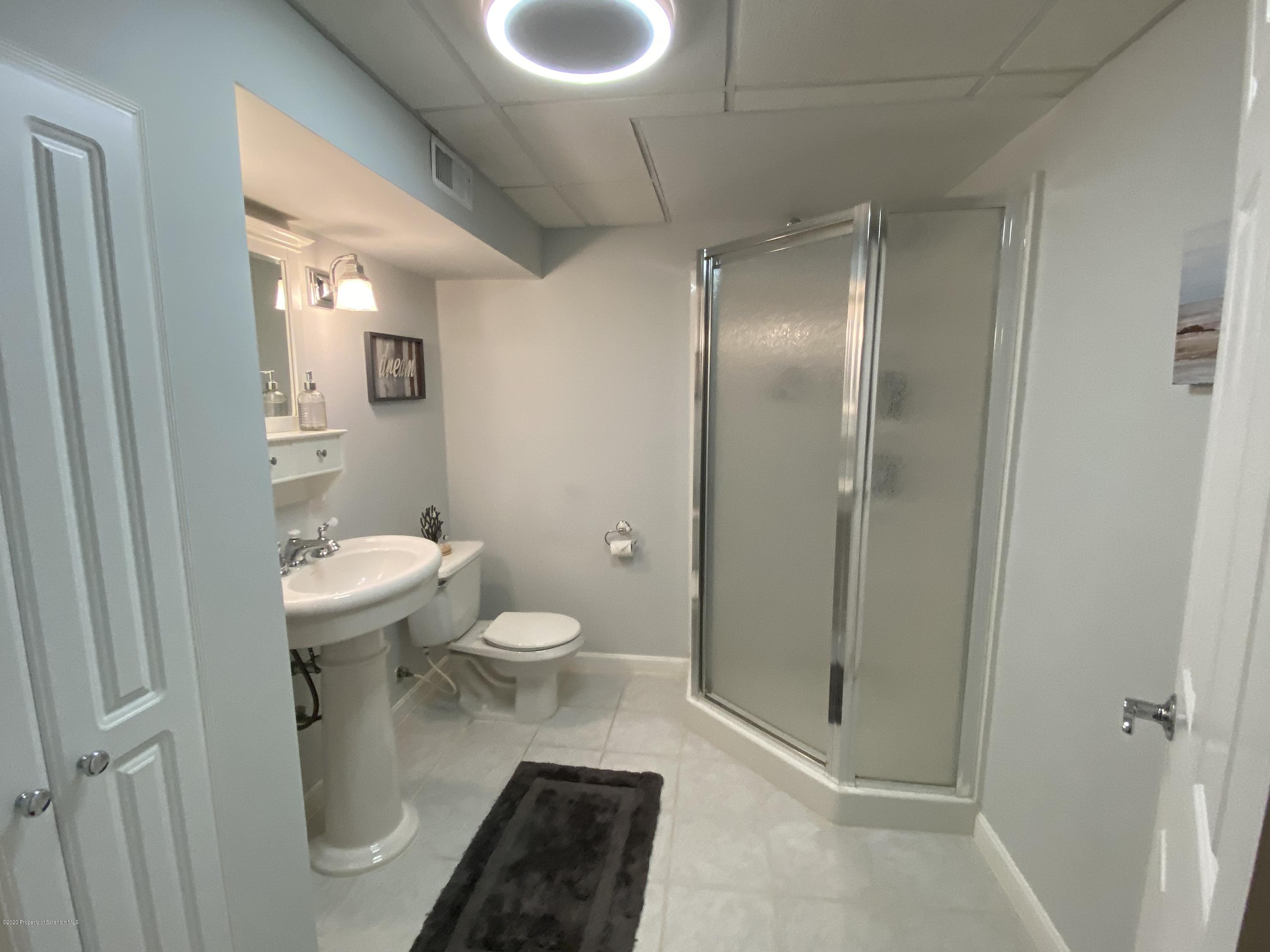 225 Terrace Street Shavertown, PA 18708 - Photo 10 of 19 a bathroom with a toilet and a shower