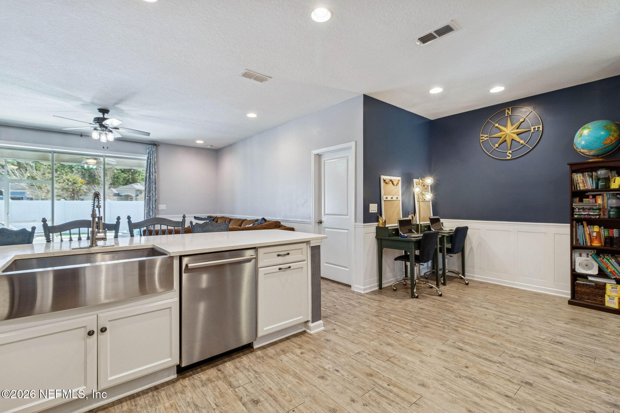 96048 Breezeway Court Yulee, FL 32097 - Photo 13 of 26 a kitchen with stainless steel appliances granite countertop a stove and a wooden floors