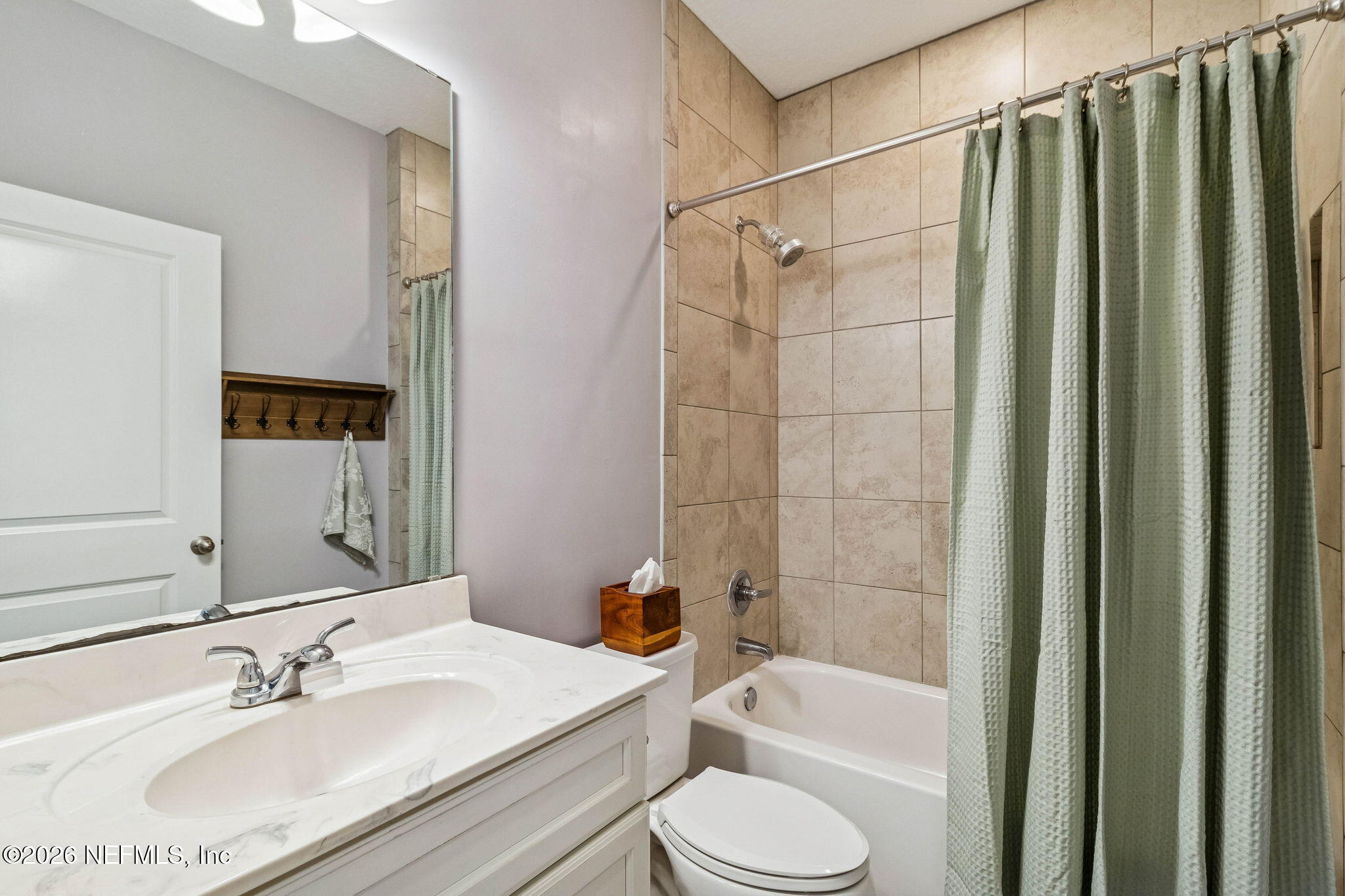 96048 Breezeway Court Yulee, FL 32097 - Photo 19 of 26 a bathroom with a sink toilet and shower