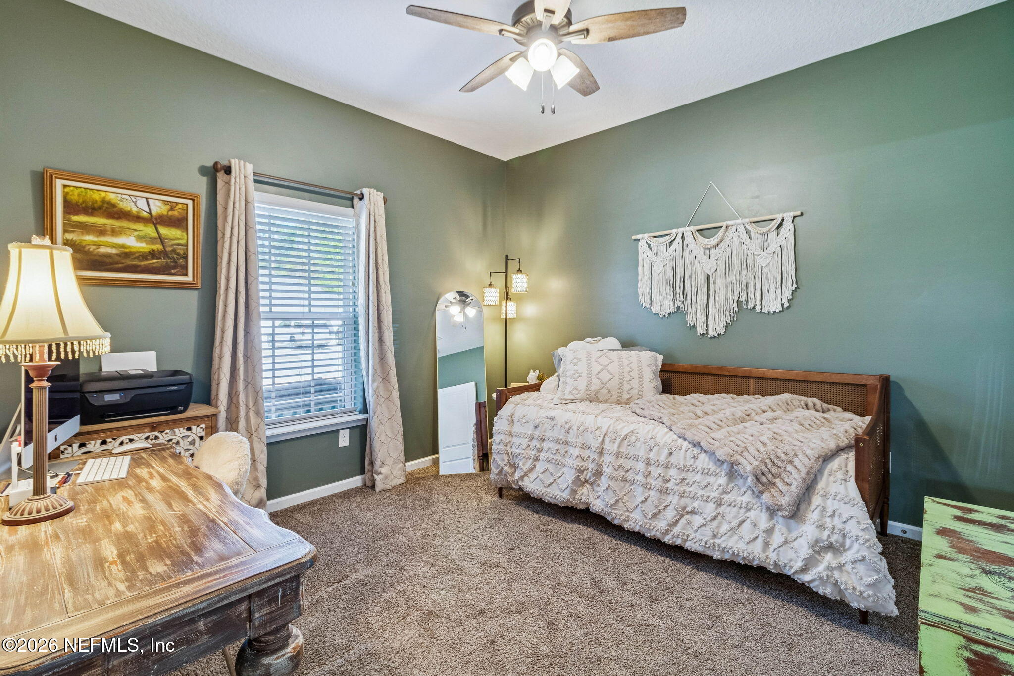 96048 Breezeway Court Yulee, FL 32097 - Photo 20 of 26 a bedroom with a bed and wooden floor